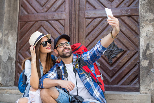 istock Tourists taking a selfie 869683332