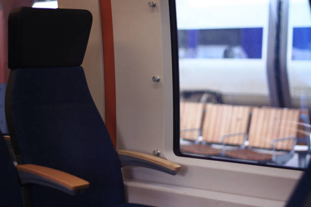 Empty travel seat next to window stock photo
