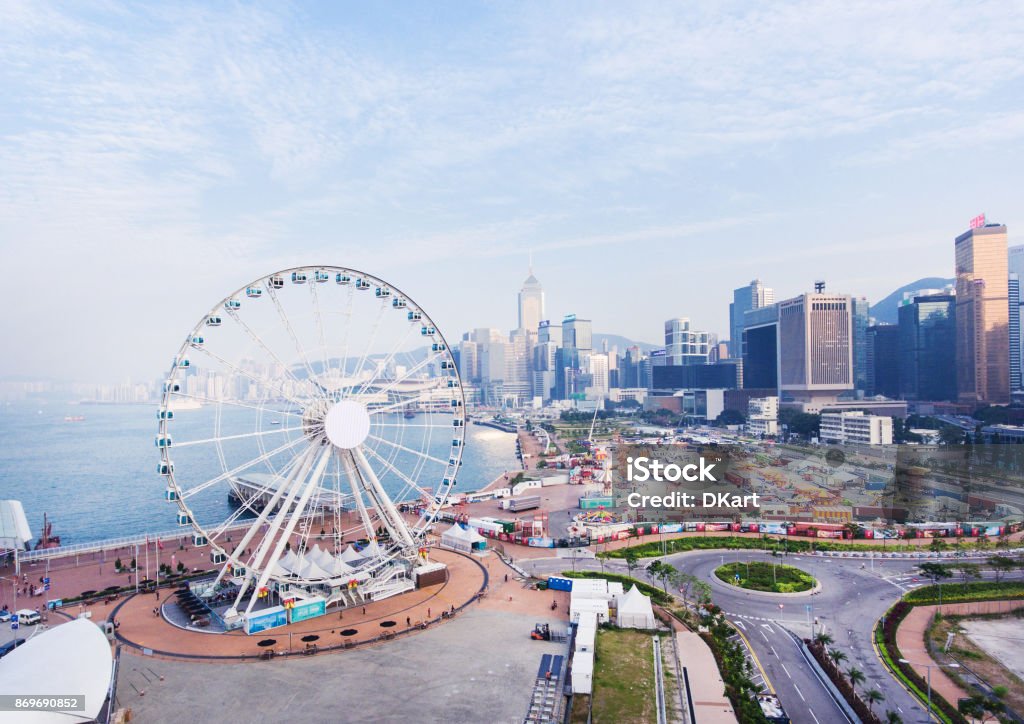 Hong Kong Skyline The giant ferris wheel located at the New Central Harborfron Harbor Stock Photo