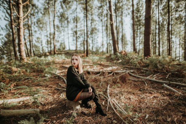 istock Young woman at forest 869694550