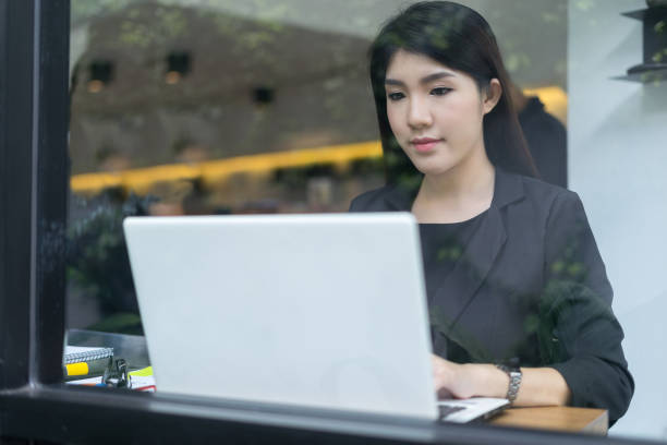 istock modern business woman working with laptop in office 869694552