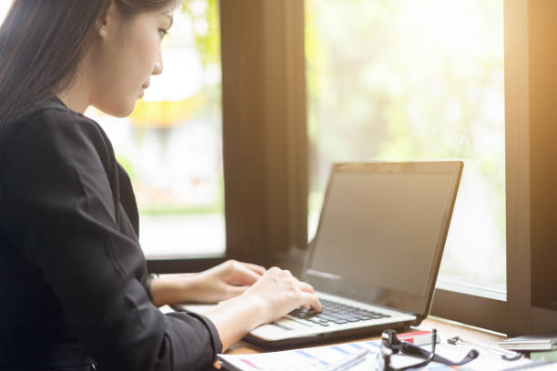 istock modern business woman working with laptop in office 869694556