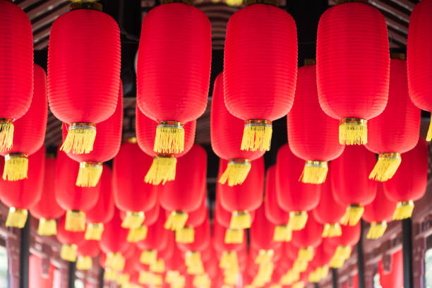 Red chinese lanterns hanging in a chinese bridge corridor close-up, Chengdu, China