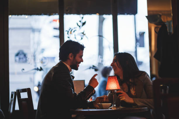 istock Cheerful couple in cafe 869702618
