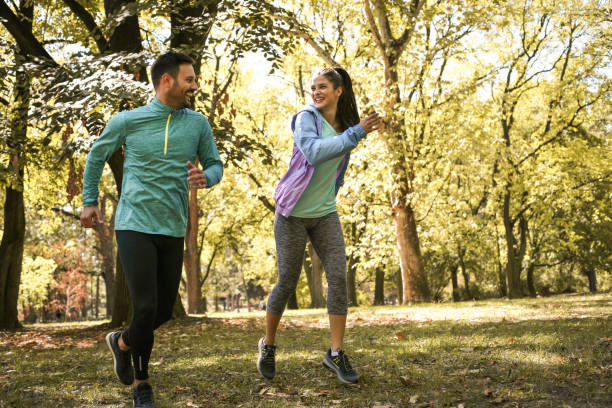 istock Happy couple exercise together outdoor. 869705840