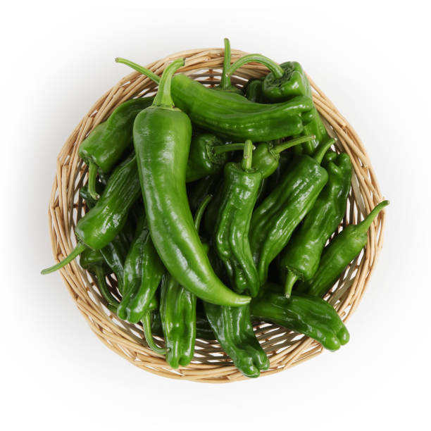 istock top view green peppers in basket isolated on white background 869707098