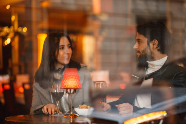 istock Catching up over a glass of wine 869707328