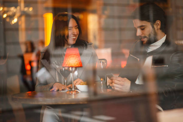 istock Catching up over a glass of wine 869707332