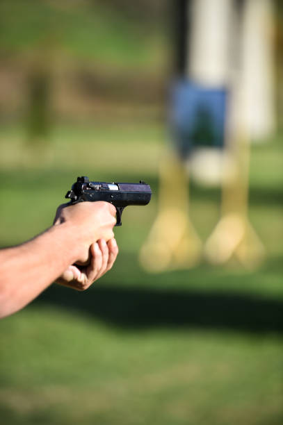 istock Outdoor shooting with a 9mm pistol 869713042
