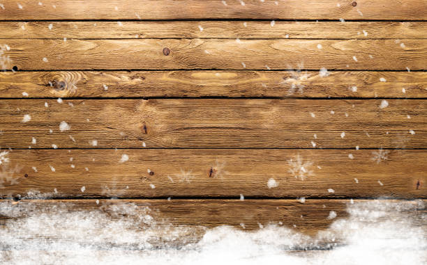istock wooden background with snowflakes 869713206