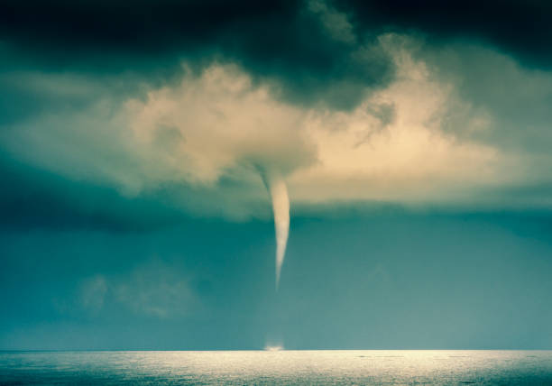 istock Extreme Weather: Tornado, Hurricane, Cyclone, Typhoon, Cumulus Clouds in moody Sky during Sumer Monsoon Thunder Storm 869716870