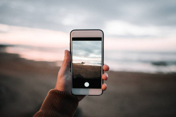 istock Taking a photo of a beach 869718232