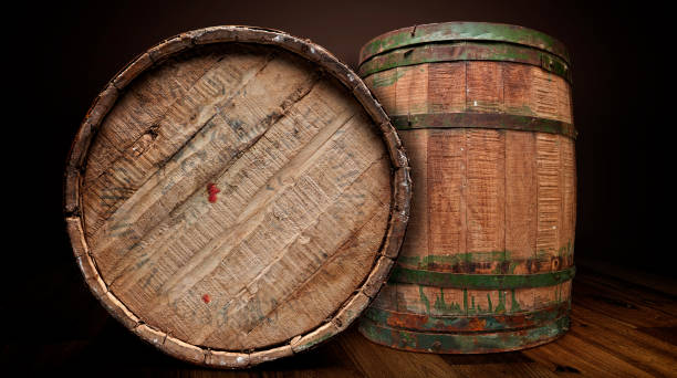 Two wooden and iron brewery barrel from front isolated with clipping path