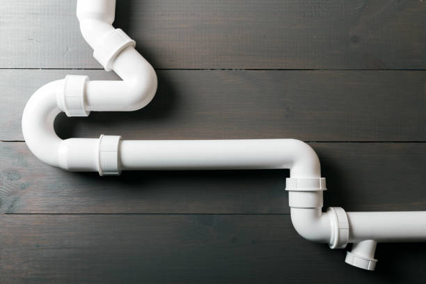 white plastic sewerage water pipes white plastic sewerage water pipes pipe tube stock pictures, royalty-free photos & images