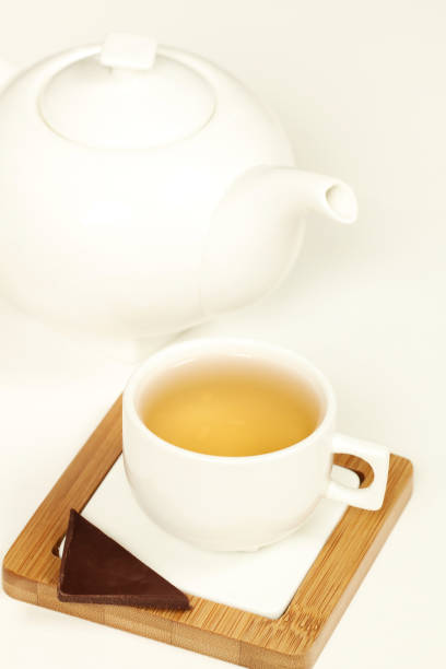 istock Hot tea in white cup and teapot 869730554