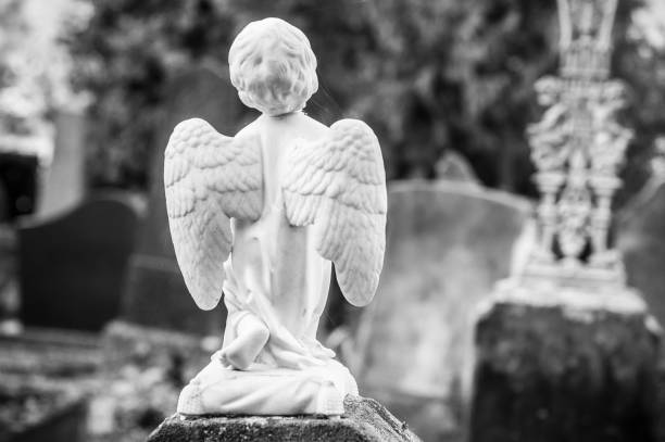 istock stoned angel in a cemetery 869735464