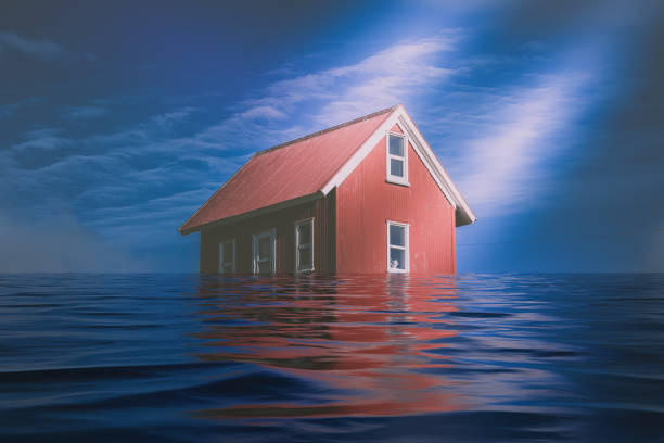 istock Bright Red Siding House in water flood 869736998