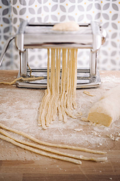 istock Making of italian Tagliatelle pasta 869737942