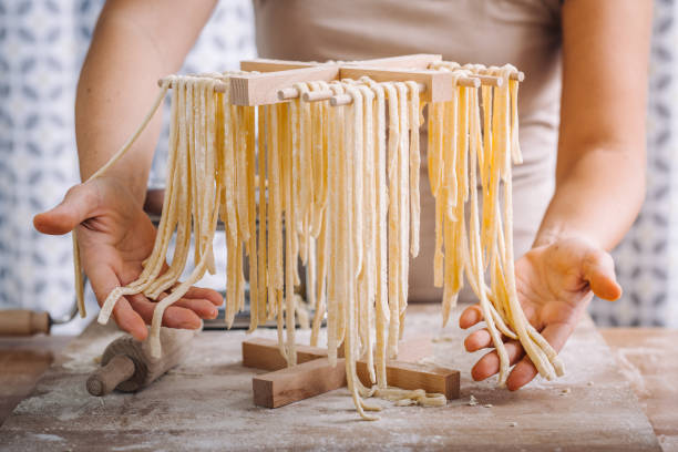 istock Making of italian Tagliatelle pasta 869738192