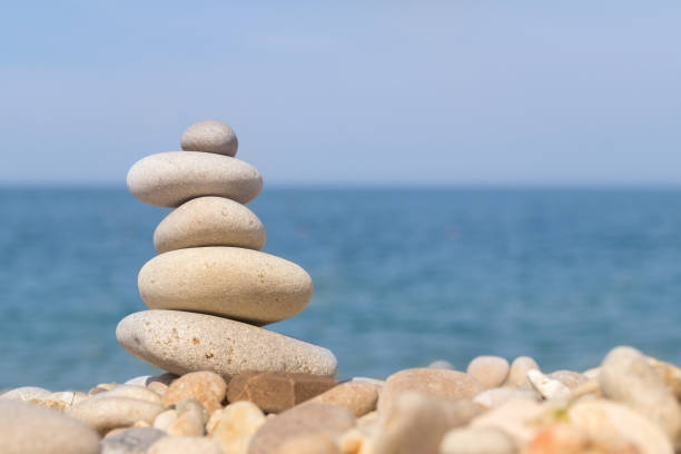 istock Pebble tower standing on the left on the sea beach 869739650