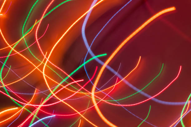 istock Neon lights blurred in motion. Abstract background. Curved bright glowing lines. 869741106