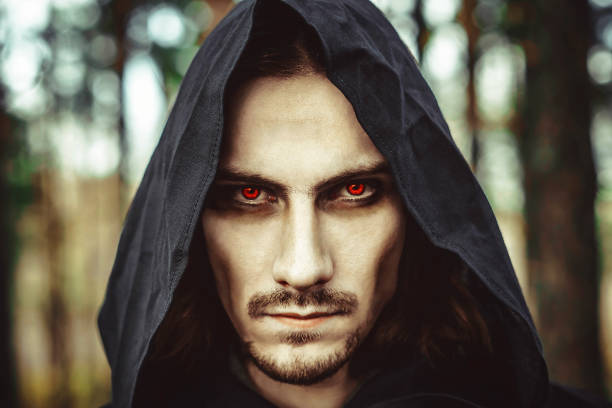 terrible in the hood the vampire in the hood with glowing eyes in the forest wizard photos stock pictures, royalty-free photos & images