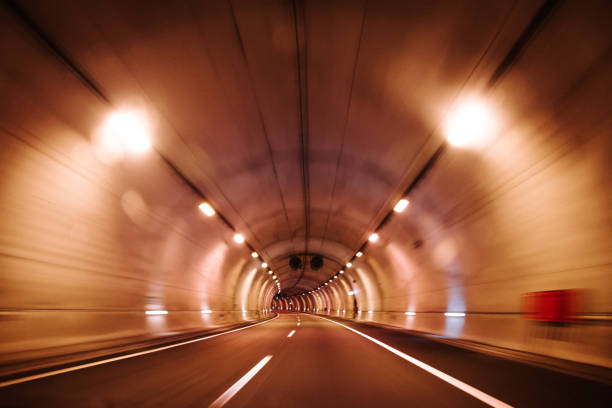 Inside view of highway tunnel  in motion.