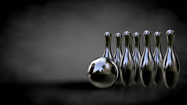 istock 3d rendering of a metalic reflective bowling set on a dark background 869750512