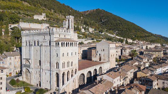 Gubbio, Italy, October 28, 2017. One of the most beautiful small town in Italy. Drone aerial view of the city center, main square and the historical building called Palazzo dei Consoli
