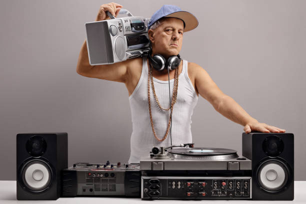 istock Old DJ with a boombox and musical equipment 869757670