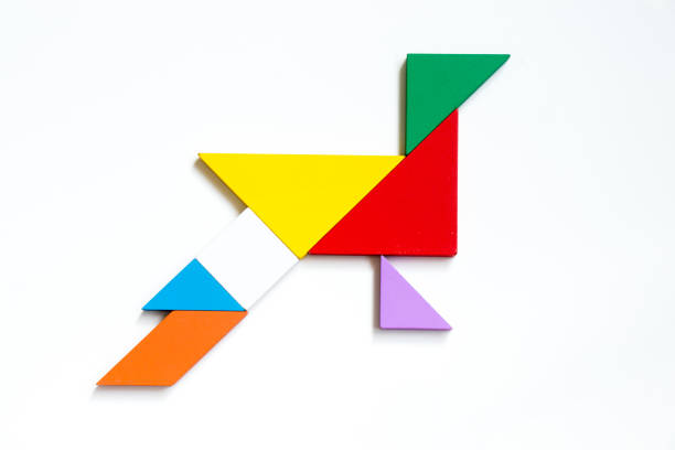istock Colorful wood tangram puzzle in peacock shape on white background 869771914