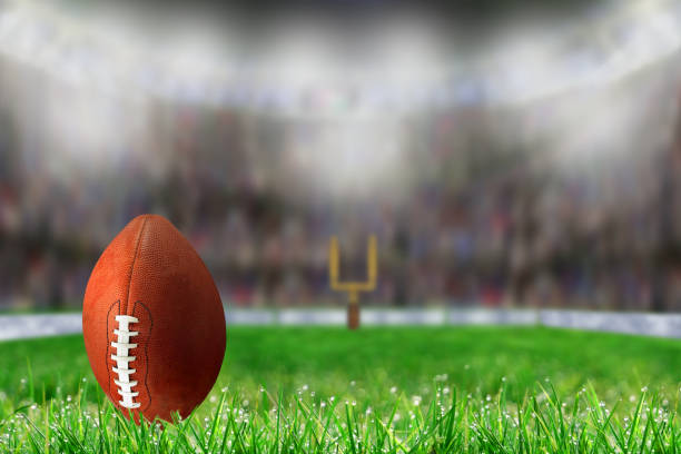 istock Football on Grass Ready For Field Goal or Kick Off 869773582