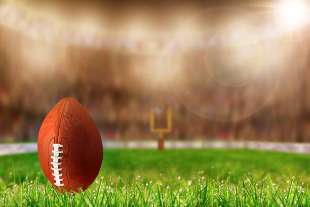 istock Football on Grass Ready For Field Goal or Kick Off 869773720