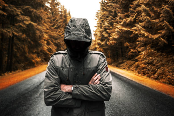 istock man walking alone in the road 869774160