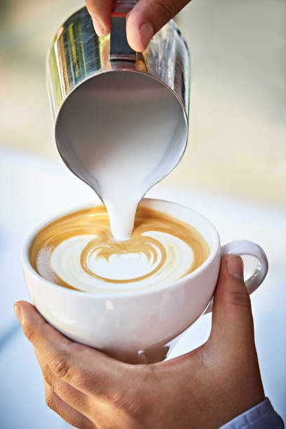 istock Pouring latte art into the cup 869782596