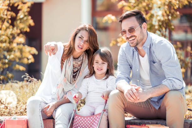 istock Happy family with one child having fun together 869785470
