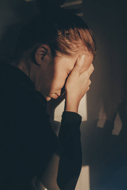 istock A woman alone and depressed 869789828