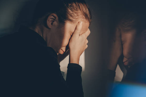 istock A woman alone and depressed 869789838
