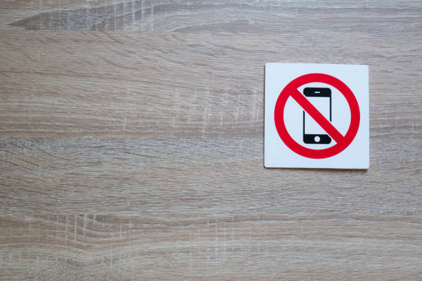 istock no phone allowed sign on wooden wall with space for adding text on the left side 869796326