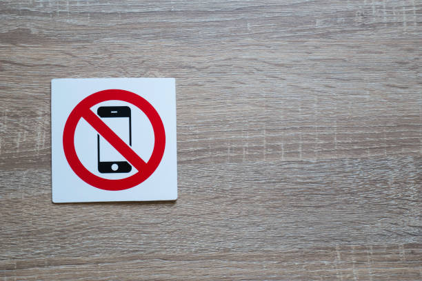 istock no phone allowed sign on wooden wall with space for adding text on the right side 869796366