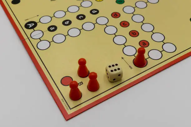 boardgame with dice and figures on white background