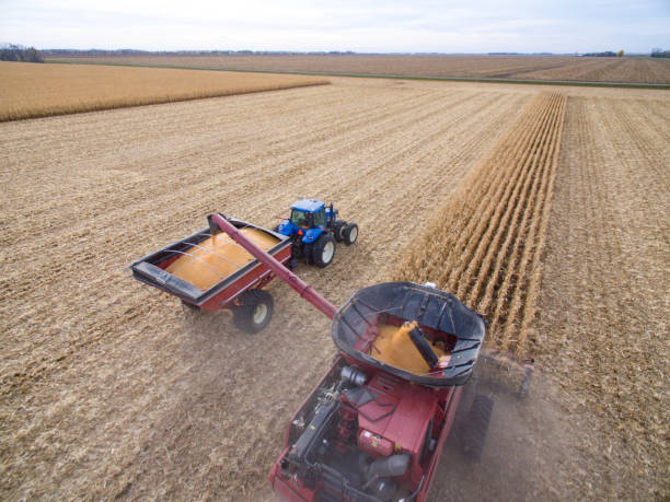 Drone photos of a combine harvesting corn