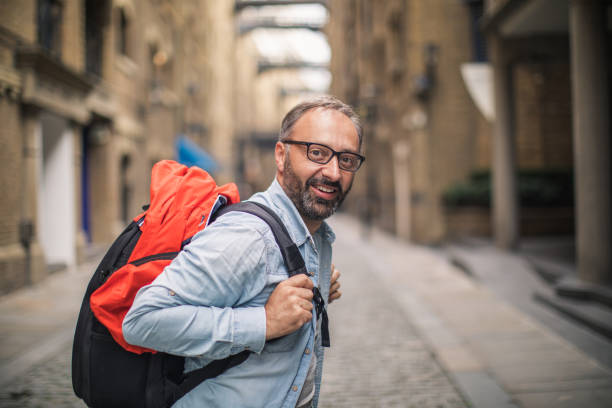 Tourist man standing on the city street