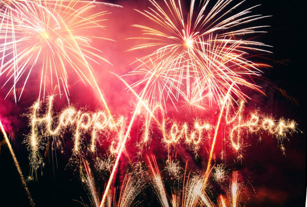 istock Sparkler Happy New Year with Fireworks on Sky 869797750