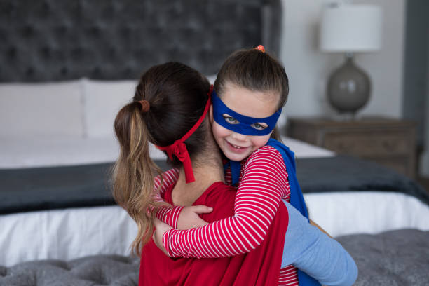 istock Mother and daughter embracing each other 869797792