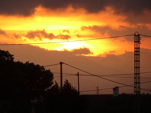 istock A cloudy sunset full of red and yellow colors 869798430