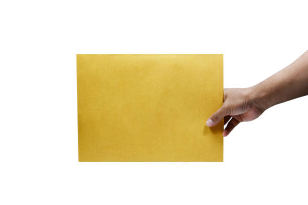 istock adult hand holding the brown envelope  on white background isolated 869805040