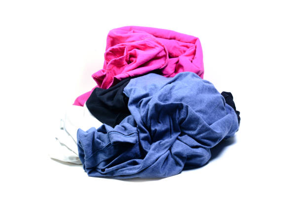 istock stack of color clothes on white background isolated 869805246