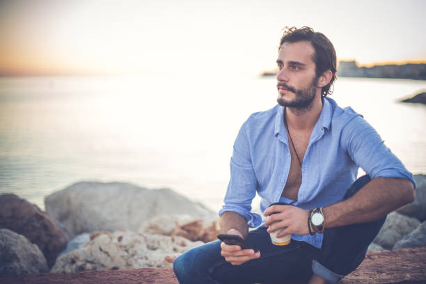 istock Man relaxing at the beach 869805658