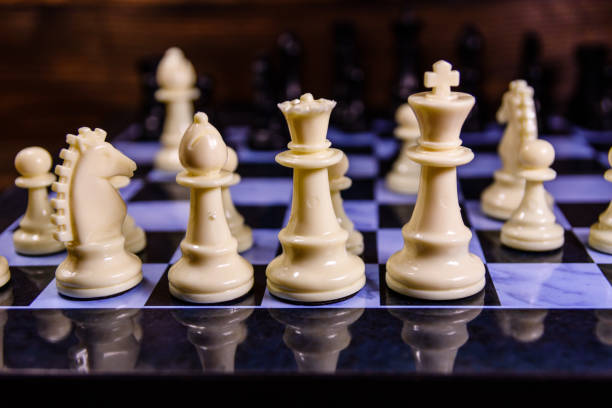 istock Composition of the chess pieces on a chess board 869821822